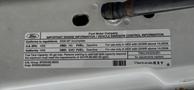 A 2008 Ford F-450 SD vehicle emission control information sticker detailing engine specifications and fuel requirements