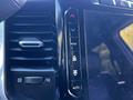 Close-up view of the climate control and air vent buttons in a 2022 RAM 3500 vehicle interior