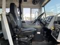 Interior view of a 2007 Blue Bird Vision school bus showing the driver's seat steering wheel and dashboard controls