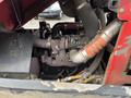 Close-up view of the engine of a 2012 Toro Groundsmaster 5910 showing hoses and components without any visible exterior parts