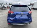 Blue 2019 Nissan Rogue showcasing its rear view with the model name visible on the trunk and rear windshield