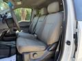 A 2019 Ford F-350 SD interior showcasing front seats with gray cloth upholstery and a spacious cabin design