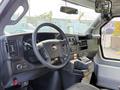 Interior view of a 2020 Chevrolet Express showing the dashboard steering wheel and control panel
