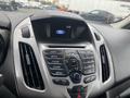 Interior dashboard of a 2017 Ford Transit Connect featuring a central control panel with radio and phone buttons and a digital display showing the Ford logo and time
