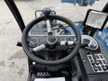 The image shows the steering wheel and control panel of a 2020 Genie GTH-5519 telehandler featuring various buttons and gauges