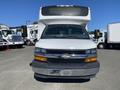 A white 2020 Chevrolet Express van with a large front windshield and prominent Chevrolet emblem on the grille