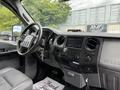 Interior view of a 2015 Ford F-350 SD featuring a steering wheel dashboard and control panel with audio system and climate controls