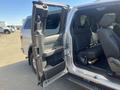 A 2014 Ford F-150 with the rear door open showing the interior seating and door panel details