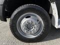 A close-up view of a silver wheel on a 2018 Ford F-550 with a black tire showing tread pattern and brand name
