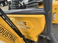 A close-up view of a 2024 AGT Mini Excavator showcasing its yellow body with the AGT Industrial logo prominently displayed on the side