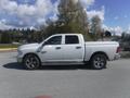 A white 2019 RAM 1500 Classic Eco Diesel pickup truck parked in profile view with chrome accents and large tires