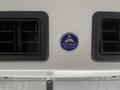 Acc Climate Control emblem set between two air vents on a 2017 Chevrolet Express