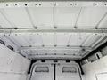 Interior view of a 2021 Mercedes-Benz Sprinter showing a white cargo space with metal framework and plain walls