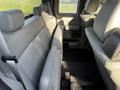 Interior view of a 2008 Ford F-150 XL showing the rear seating area with gray fabric seats and a spacious layout