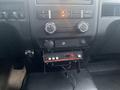 Interior dashboard of a 2013 Ford F-150 featuring climate control knobs and a car stereo system installed in the center console