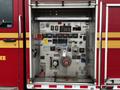 Close-up of the control panel on a 2009 Spartan Gladiator fire truck featuring numerous gauges buttons and switches for managing firefighting equipment