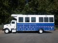 2008 Peterbilt PB340 truck with a white and blue design featuring large windows and an elevated rear section designed for mobile use