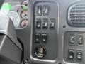 Control panel of a 2016 Freightliner 108SD featuring various switches and gauges indicating engine status and vehicle functions