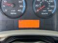 Dashboard of a 2018 International DuraStar showing speedometer RPM gauges and a digital display with mileage 274558 km and temperature 21°C