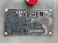 A metal identification plate displaying the text "Sutphen Corp Columbus Ohio Serial No HS 2526" on a surface