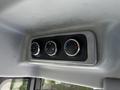 Controls for air conditioning and ventilation with three circular knobs in a vehicle