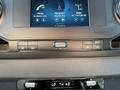 Dashboard controls of a 2023 Mercedes-Benz Sprinter featuring audio and navigation settings