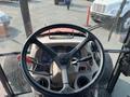 View of the steering wheel and dashboard of a 2014 Kubota M7060 tractor showing various gauges and controls