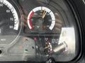 Dashboard of a 2012 Autocar Xpert showing gauges for PSI, oil, battery voltage, and fuel level along with warning lights