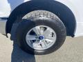 A 2019 Ford F-150 wheel featuring a silver alloy rim and a rugged tire tread design