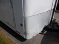 A 2004 Royal 18 foot office trailer with a diamond plate metal exterior on the lower section and a door on the side