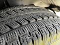 Close-up of a tire tread from a 2015 Chevrolet Express showing detailed patterns and grooves designed for traction