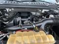 Close-up view of the engine compartment of a 2017 Ford F-150 showcasing the engine components and coolant reservoir