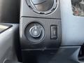 Control panel of a 2011 Ford F-450 SD featuring dials for lights and other functions