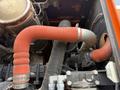 Close-up of engine hoses on a 2018 Doosan DL300 -5 showing red and gray colored tubing connecting various components of the engine