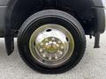 A close-up of a chrome wheel of a 2019 Ford F-550 showing its shiny surface and distinct bolt pattern