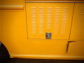 2008 Freightliner MT45 Chassis in bright yellow color with a textured side panel featuring multiple vertical slats and a lockable compartment door