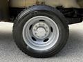 Close-up of a 2016 Ford F-550 wheel featuring a silver rim and Michelin tire with visible tread pattern
