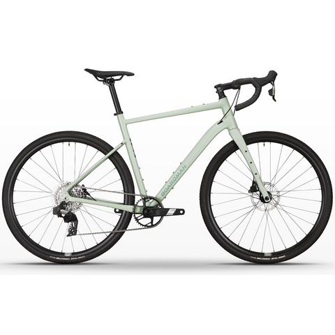A 2026 Boardman ADV 9.2 road bike featuring a light green frame drop handlebars disc brakes and thick tires designed for varied terrains