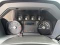 The dashboard of a 2015 Ford F-350 SD showing speedometer tachometer fuel gauge temperature gauge and an hour meter