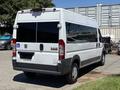 A white 2016 RAM Promaster van with a sliding side door and a wheelchair accessibility symbol on the rear door