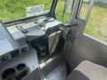 Interior view of a 2007 Morgan Olson Workhorse W42 with metallic surfaces a storage basket and controls visible