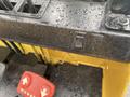 Close-up of the control panel of a 2010 Hyster S80XLBCS forklift featuring a joystick throttle switch and red foot pedals for forward and reverse operation