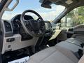 Interior view of a 2020 Ford F-350 SD featuring a steering wheel dashboard and seats with gray fabric upholstery