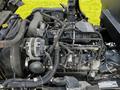 A 2016 Isuzu NPR engine is displayed showing various components including belts wiring and an alternator