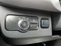 A control panel in a 2020 Mercedes-Benz Sprinter featuring a dial for light settings and switches for additional functions