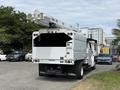 A 2020 Freightliner M2 with an Altec bucket truck mounted on the rear and a white utility body