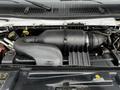 Engine compartment of a 2016 Ford Econoline showing the air intake system and various engine components