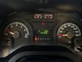 The dashboard of a 2017 Ford Econoline featuring gauges for fuel temperature RPM speedometer and odometer with a trip display