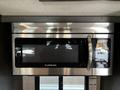 A stainless steel Furrion microwave installed in a recreational vehicle