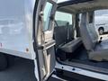 A 2008 Ford F-450 SD with an open passenger door showing the interior seating arrangement and a large cargo area behind the front seats